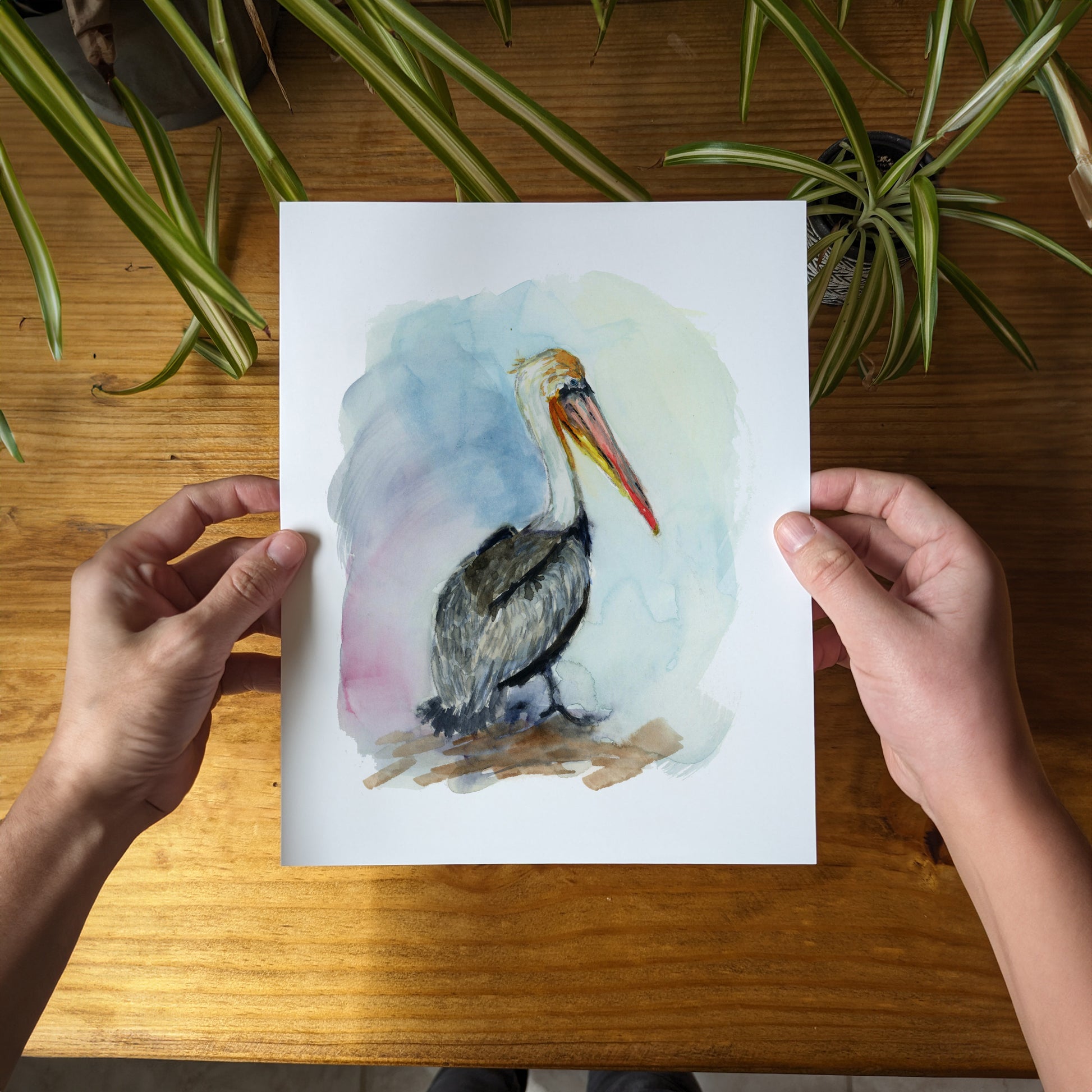 a person holding a card with a bird on it