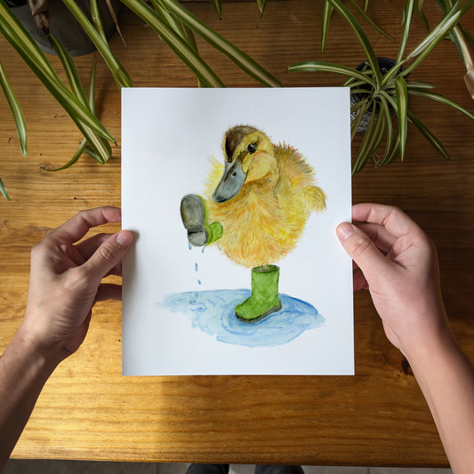 a person holding a card with a picture of a duck on it
