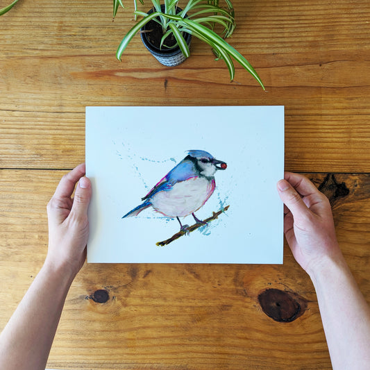 a person holding a card with a bird on it